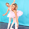 Two blonde teen ballerinas love to use some toys together